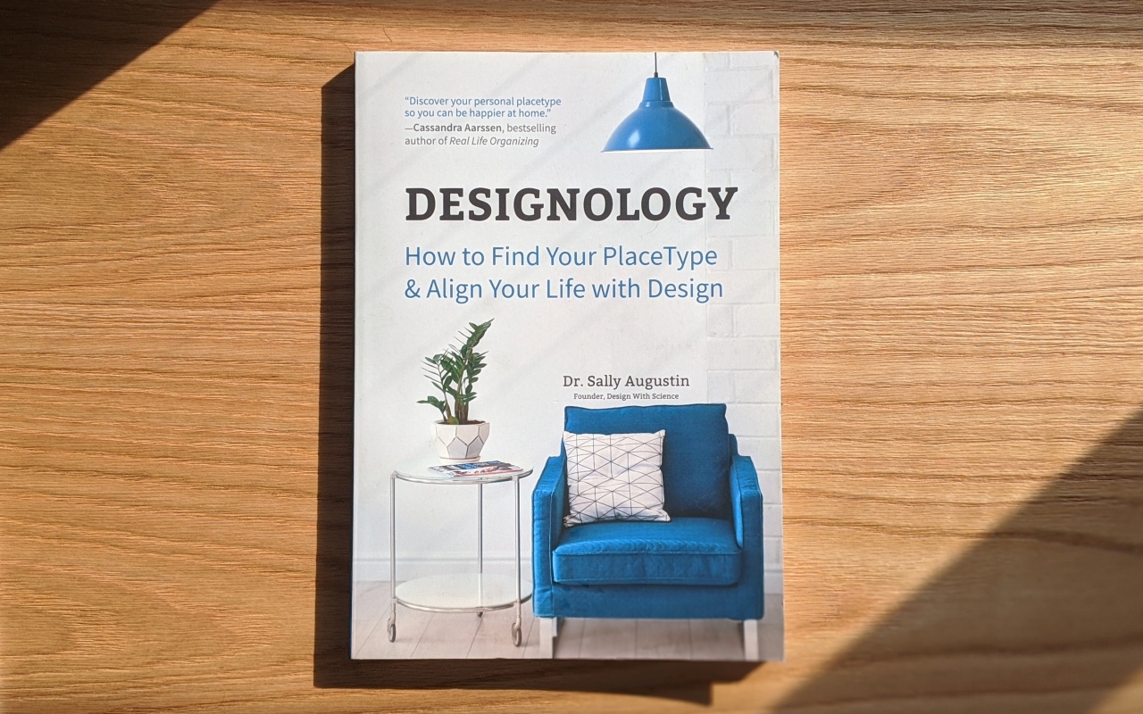 A picture of Sally Augustin's book laying flat on a wooden table