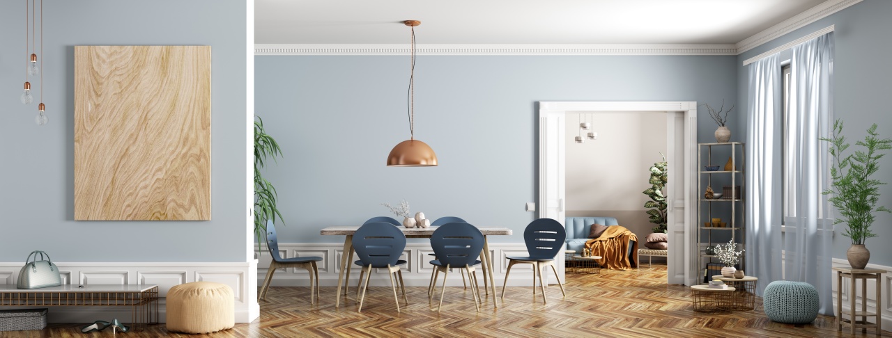 an apartment interior with a table, chairs, a sofa and some artwork, representing moderate visual complexity